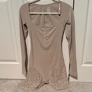Skims long Sleeve Scoop Neck Bodysuit with Lace Trim at the bottom - Taupe